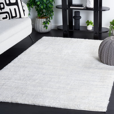 Tapis ivoire / gris clair en polyester tissé à la machine Idhika