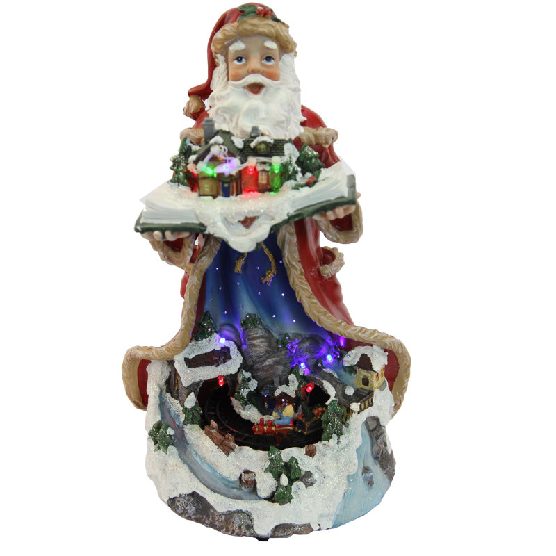 Père Noël illuminé et train en mouvement