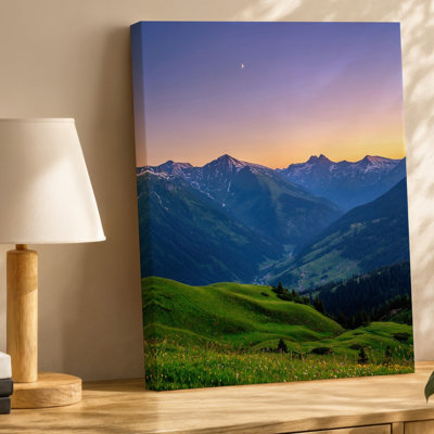 Canvas A Serene Mountain Landscape During Twilight Showcasing Majestic Peaks With Wall Art Patches Of Snow Surrounded By Lush Green Canvas Wall Art