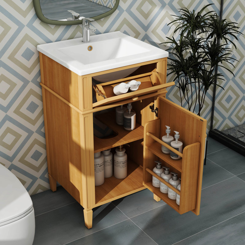 Meuble-lavabo de 20 po en bois avec lavabo, supporté par des pieds en bois massif, comprenant un tiroir inclinable et une tablette réglable