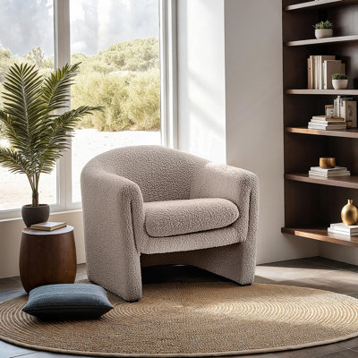 Chaise d'appoint de style contemporain avec une taille compacte et une conception en forme de U, tissu Boucle pour une expérience de salon moderne et confortable