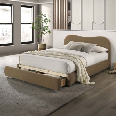 Luxueux lit tapissier en velours avec tête de lit incurvée et rangement, idéal pour les chambres contemporaines et peu encombrant.
