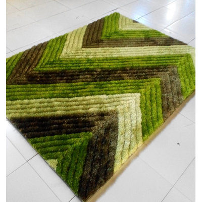 Tapis tissé à la machine vert