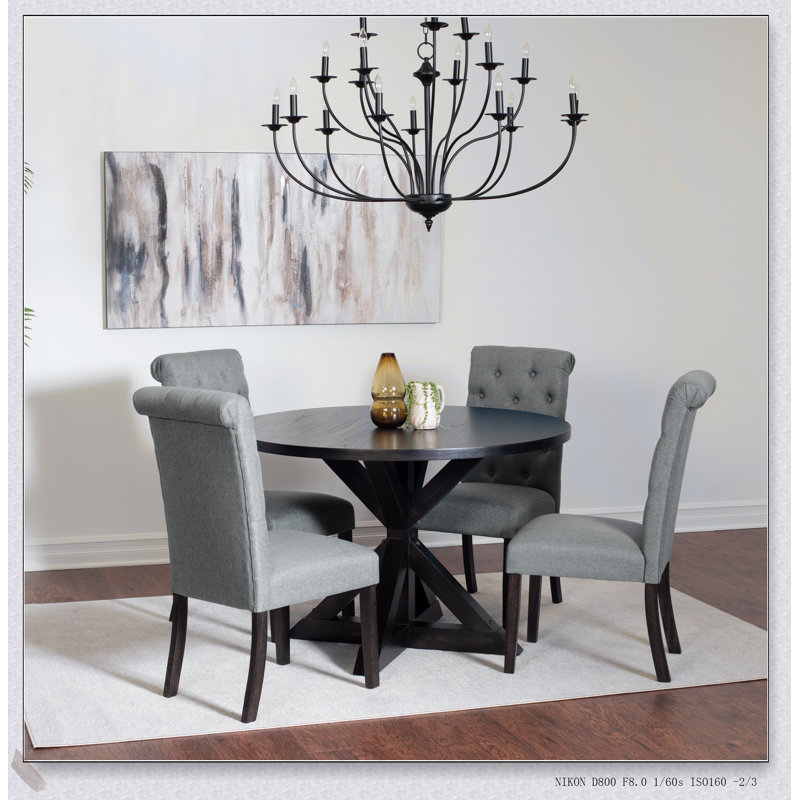 Ensemble repas 5 pièces avec table croisée et chaises élégantes Nylander, parfait pour les intérieurs modernes et rustiques