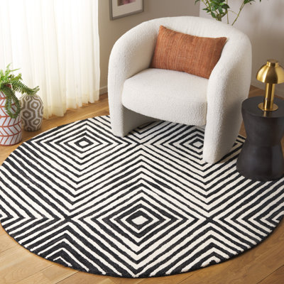 Tapis noir / ivoire en laine / coton touffeté à la main Joahan