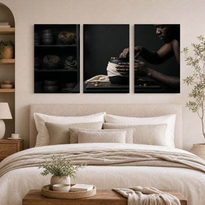 Potter Wrapping Black Clay Pot With White Cloth Set Of 3 Canvas Wall Art