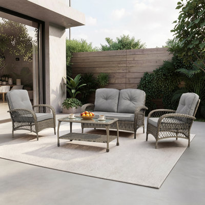 Modesto 4-Person Wicker / Rattan Outdoor Sofa Seating Group with Glass-Top Shelf-Storage Table & Cushions