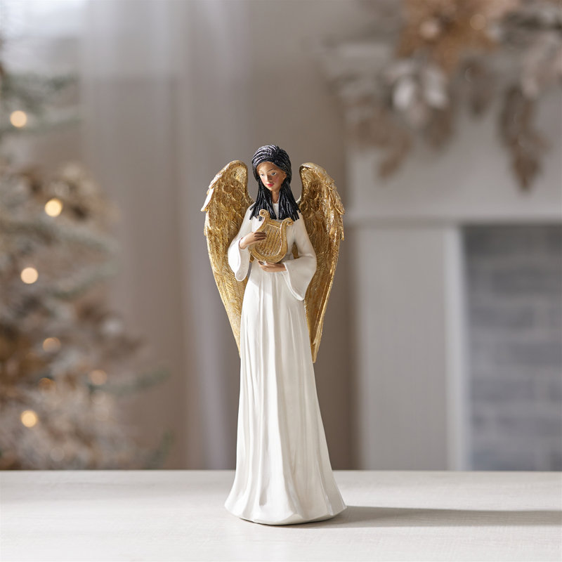 Figurine d'ange avec harpe et ailes dorées