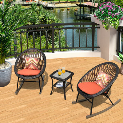 Chaise berçante d'extérieur avec coussins Baum