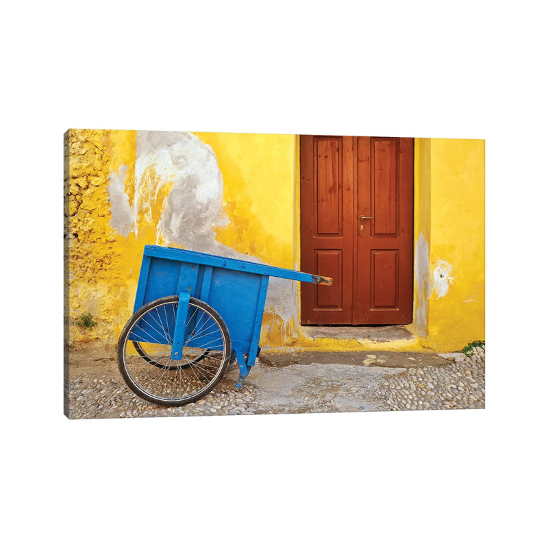 Greece, Rhodes. House With Blue Cart In Front. by Jaynes Gallery - Wrapped Canvas Print, 30.48cm H x 45.72cm W