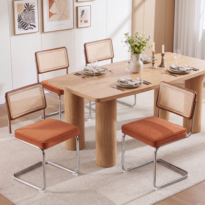 Walton Cantilevered metal dining chairs with rattan back