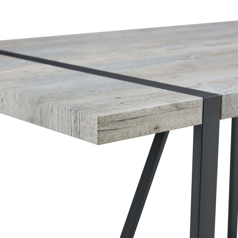 Ensemble de table et de chaises. Une table de salle à manger rectangulaire rétro minimaliste avec un dessus spécialement texturé et des pieds en métal, jumelée à 4 chaises