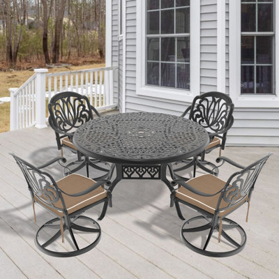 Ensemble de salle à manger 5 pièces en fonte d'aluminium avec chaises pivotantes et table ronde, parfait pour les réceptions en plein air et la durabilité.