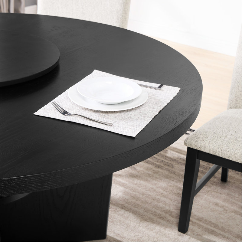 Table ronde moderne avec plateau tournant, offrant une élégance intemporelle et pratique pour la salle à manger.
