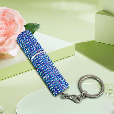 Bouteille d'eau, vaporisateur de parfum et porte-clés