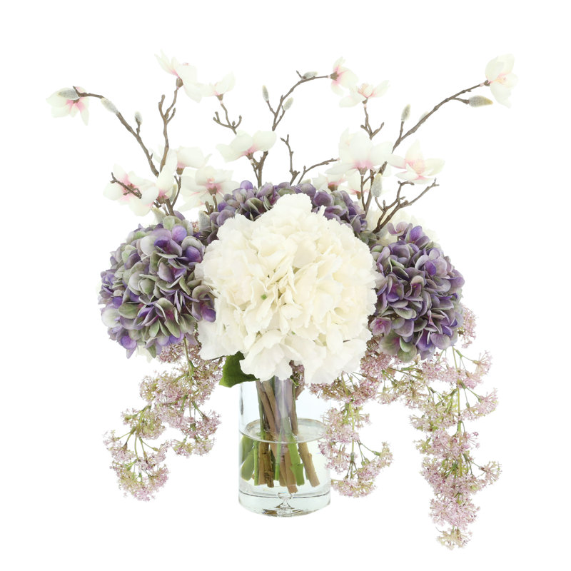 Hydrangea, Laurel and Magnolia Arrangement in a Glass Vase