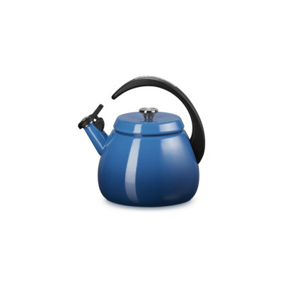 Pale enamel-on-steel stovetop kettle photographed for a retailer listing