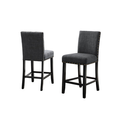 De 2 tabourets de comptoir, tissu gris rembourré avec garniture cloutée, ornement en bois franc à 2 garnitures, fabrication solide
