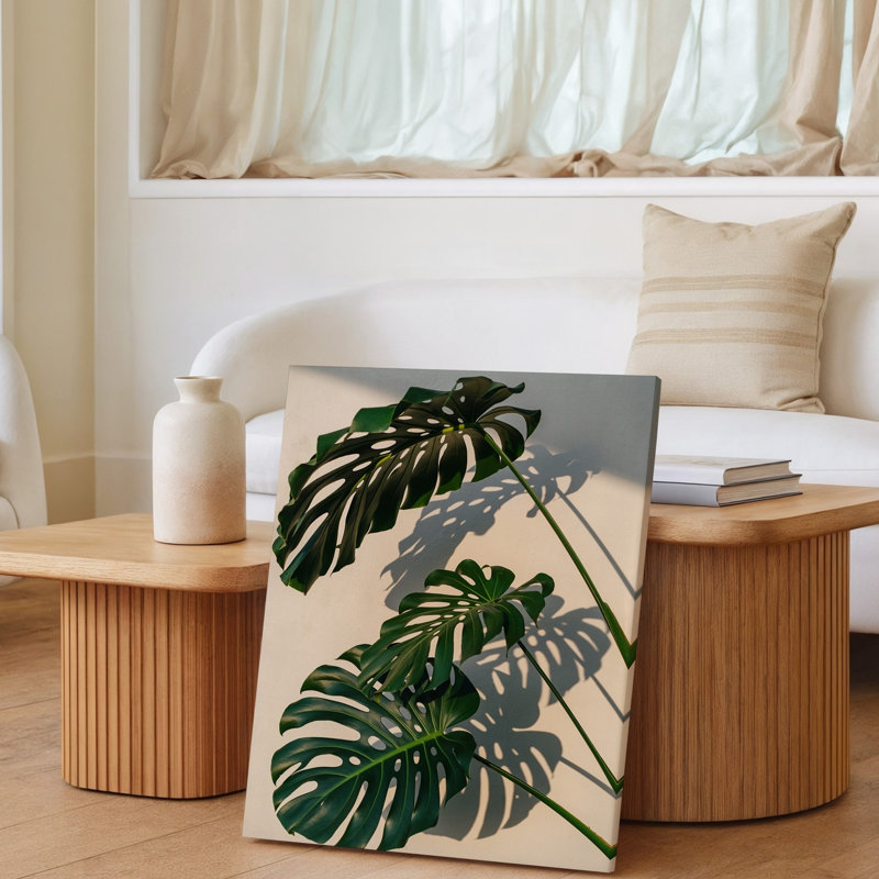 Toile, composition rapprochée de feuilles de Monstera vibrantes avec leur art mural, motifs iconiques divisés et perforés