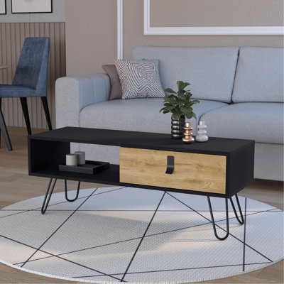 Table basse moderne et noire avec tiroir ouvert pour le décor du salon, avec pieds en épingle et beaucoup d'espace de rangement