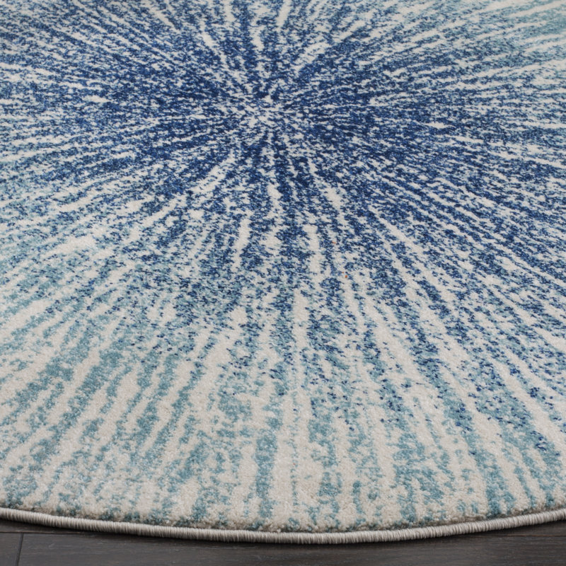 Tapis à motifs abstraits bleu royale et ivoire Faustina, Rond 8 pi