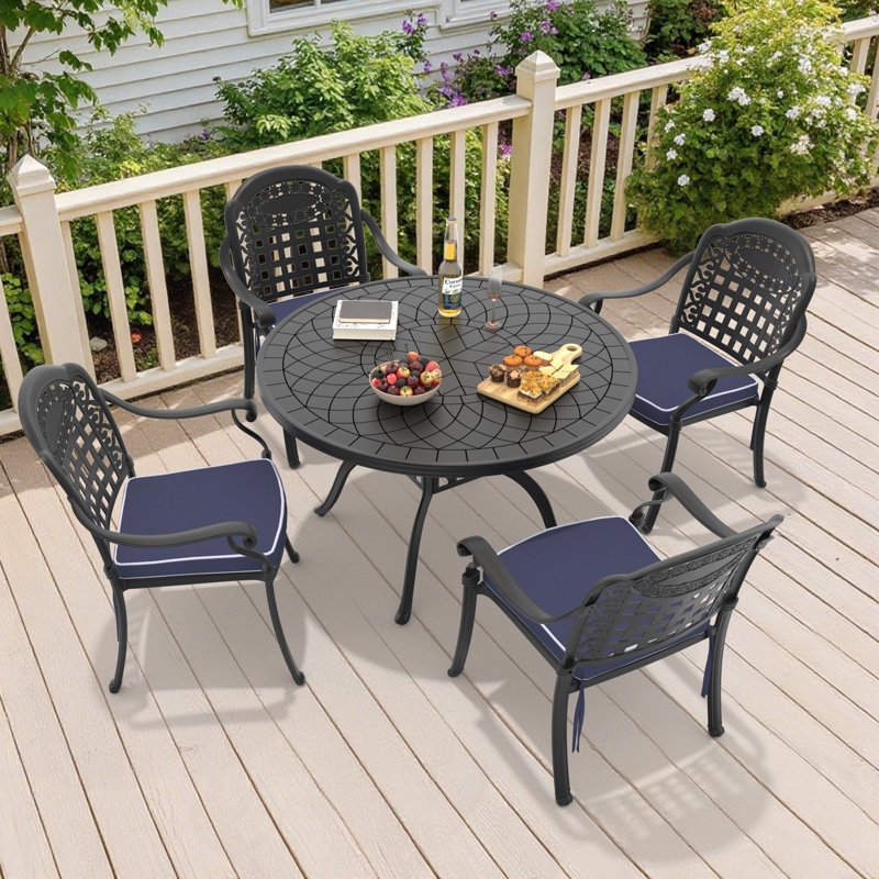 Ensemble de salle à manger rond pour patio 4 personnes 47,24 po avec 4 chaises empilables, coussins bleus