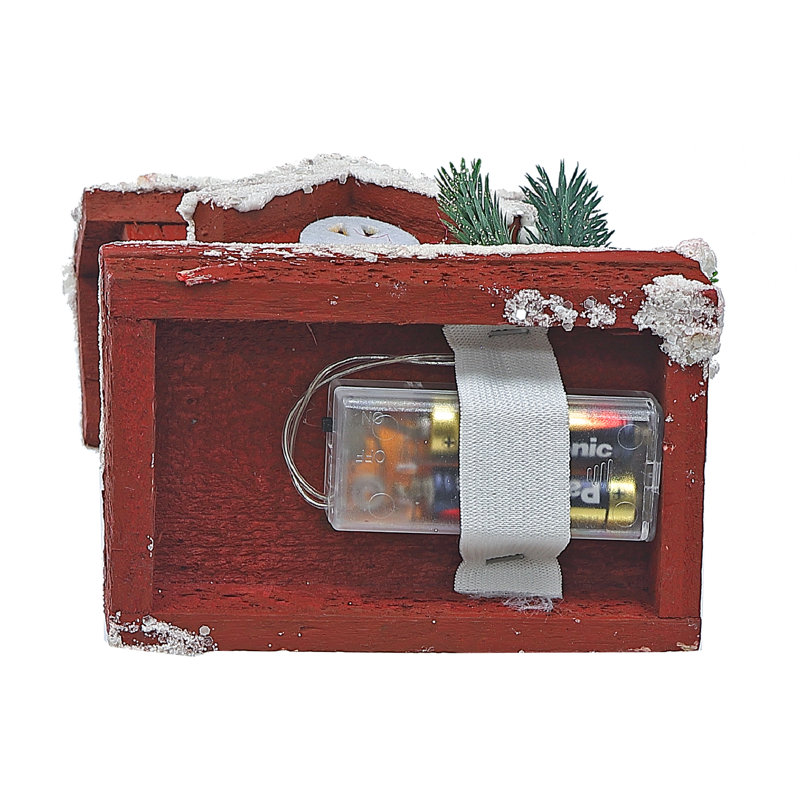 Maison en bois DEL recouverte de neige