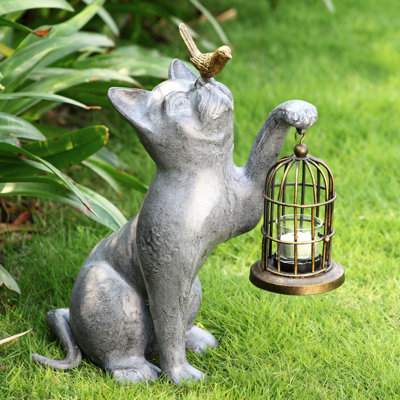 Statue de chat avec oiseau