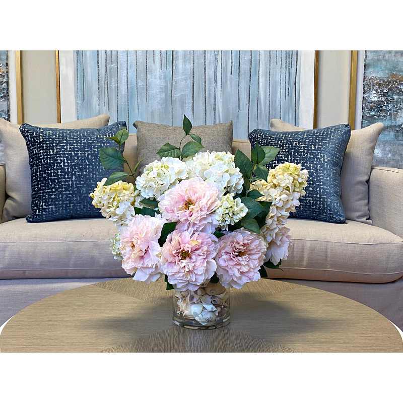 Peony and Hydrangea Arrangement in a Clear Glass Pot with Seashell