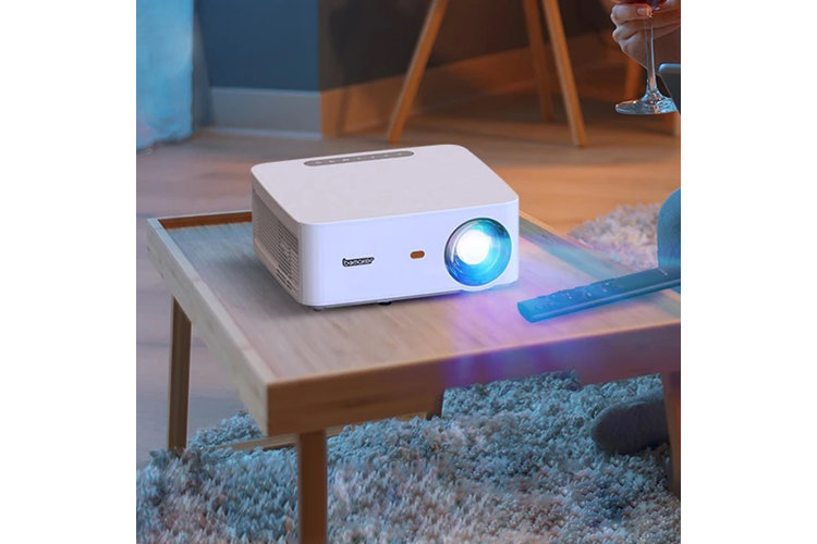 white projector on a side table