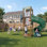 Ensemble de jeu multifonctionnel pour enfants 3-10, en acier galvanisé robuste avec glissade en tube, balançoires doubles, structure d'escalade, cerceau et bac à sable intégré