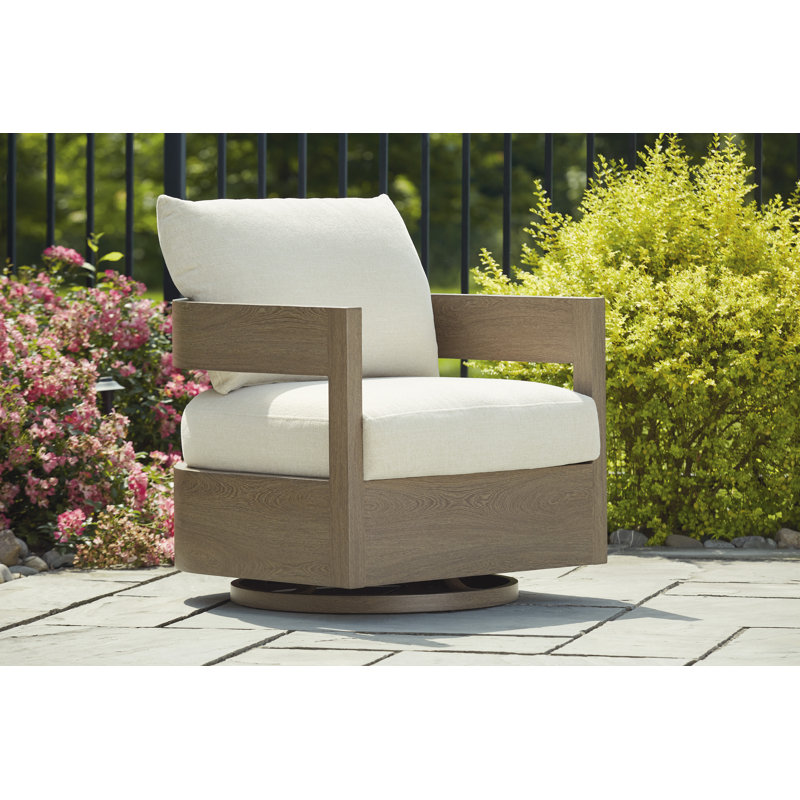 Fauteuil oscillant pivotant avec coussin Alesana