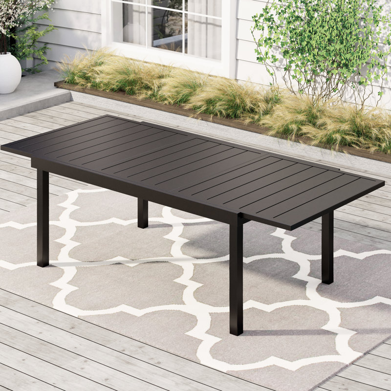 Armisha 8 - Person Patio Dining Set with Extendable Rectangular Table , Cushions Included