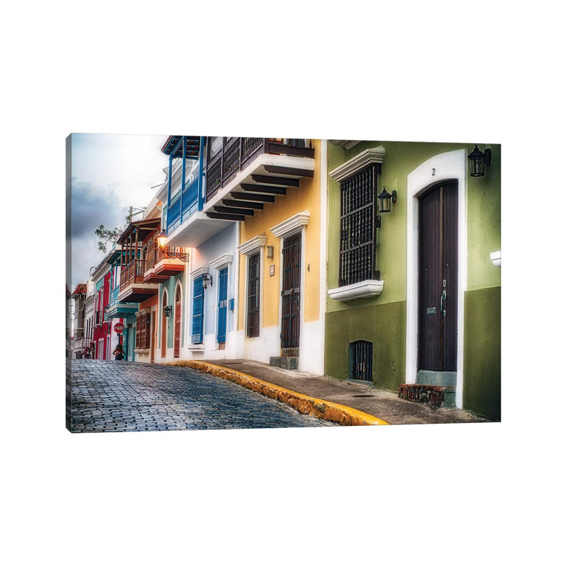 Low Angle View Of Houses On A Cobblestone Street by George Oze - Wrapped Canvas Painting, 66.04 cm H x 45.72 cm W x 1.91 cm D