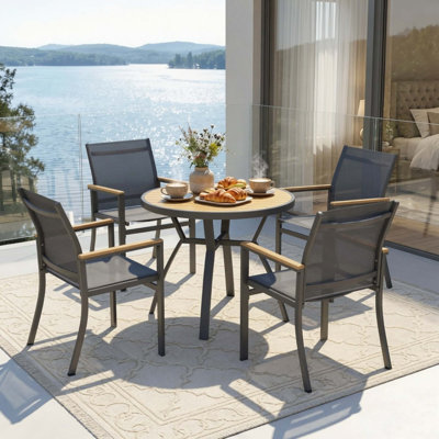 Ensemble de salle à manger d'extérieur en aluminium 5 pièces avec chaises en textilène et table ronde en polystyrène haute densité.