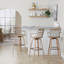 Tabouret de bar à hauteur fixe avec pivot en bois blanchi et métal cuivre antique avec repose-pieds carré en métal cuivre antique