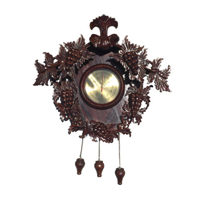Horloge raisin sculptée