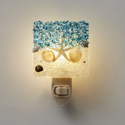 Sable et mer avec veilleuse DEL étoile de mer