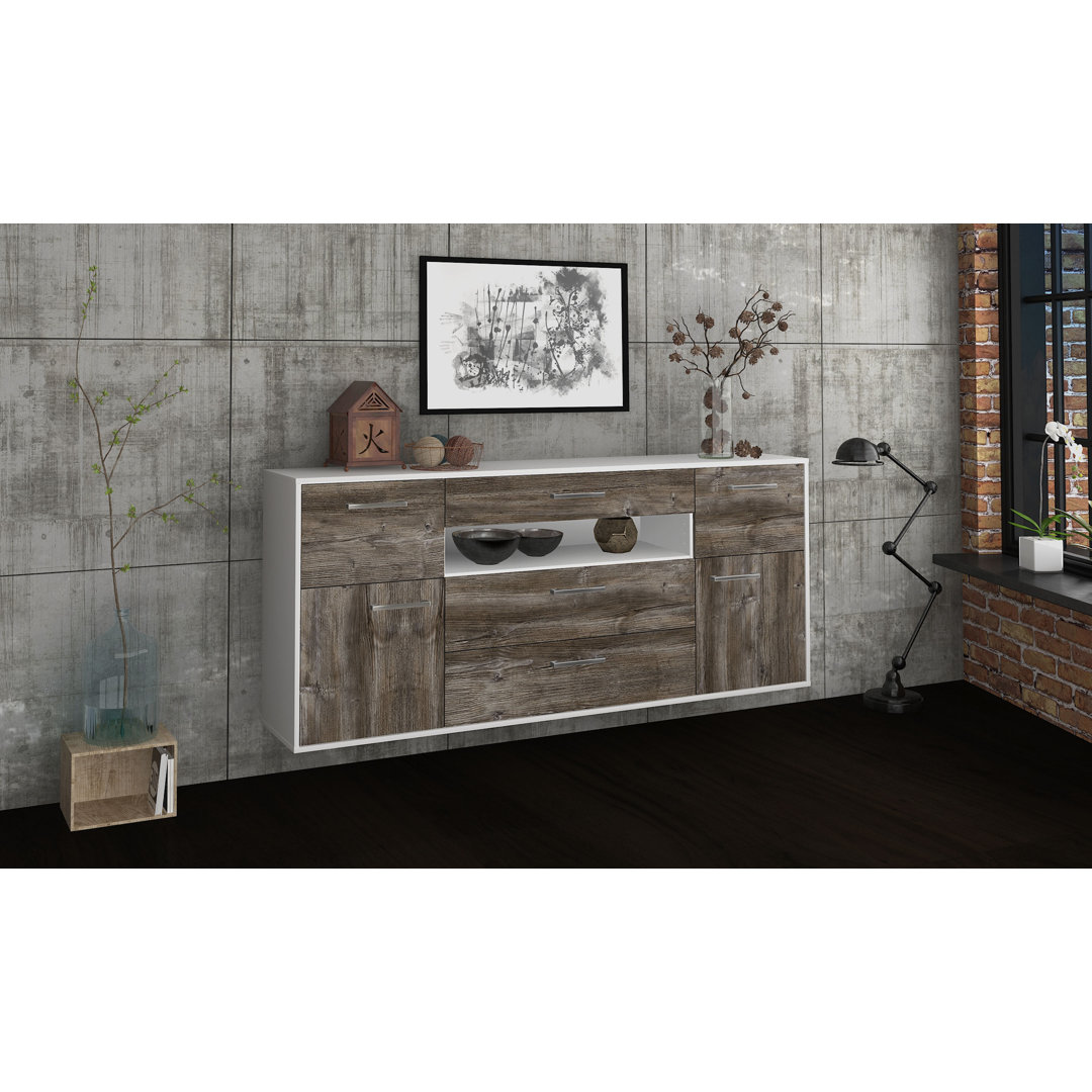 Das Sideboard Barri hat Metallgriffe und die Maße 180 cm x 79 cm x 35 cm.