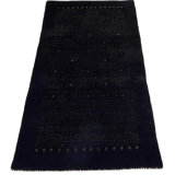Ovide Polka Dots Area Rug in Black