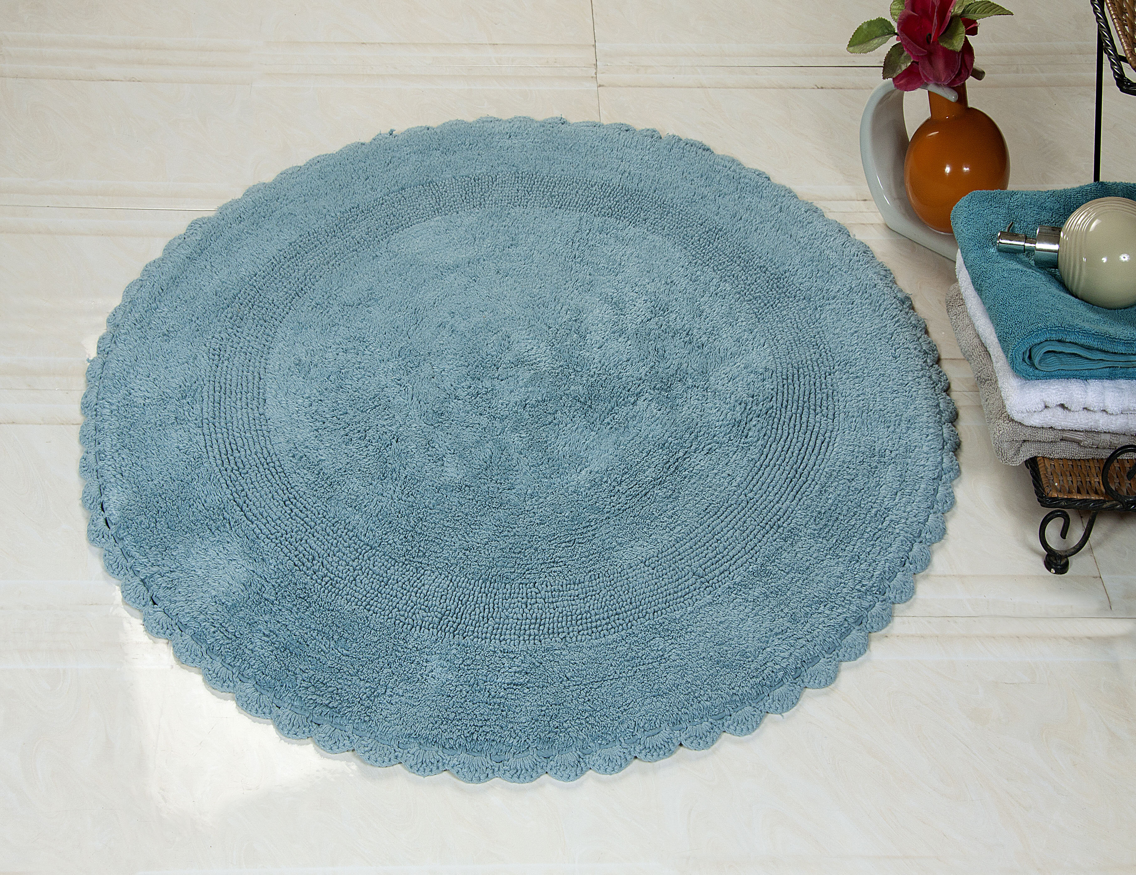 https://assets.wfcdn.com/im/12722729/compr-r85/1653/16533186/jarris-soft-circle-100-cotton-reversible-bath-rug.jpg