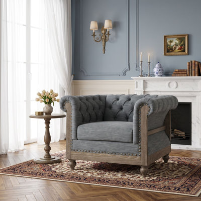 Fauteuil club capitonné