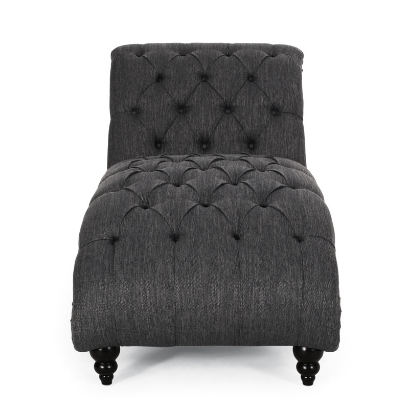 Chaise longue avec motif courbé et capitonnage à boutons, coutures en losanges, revêtement en tissu gris anthracite, capitonnage aux pieds en bois de bouleau et forme confortable, tissu
