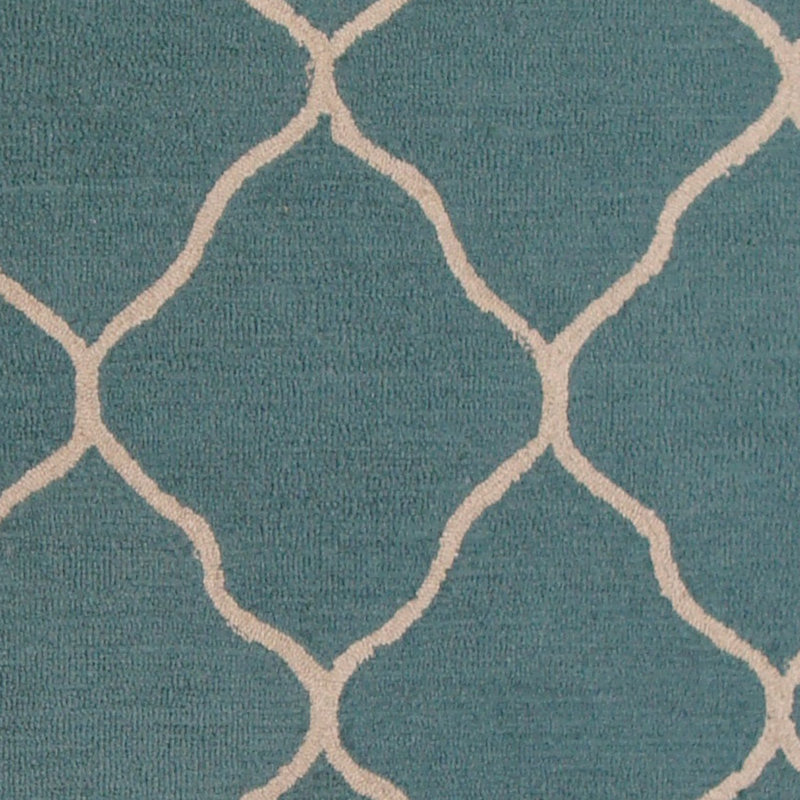 Tapis bleu clair / beige touffeté à la main