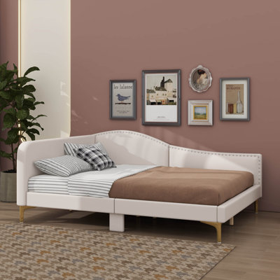 A Luxurious Upholstered Daybed With A Stylish Headboard And Comfortable Armrests