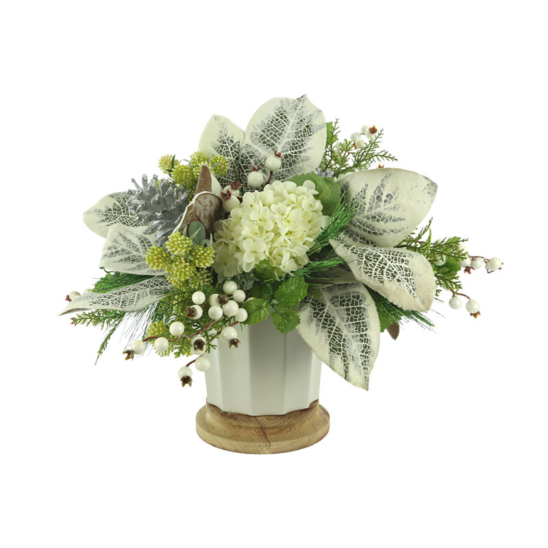 Snowy Holiday Arrangement with Hydrangeas, Magnolia Leaves and Berries