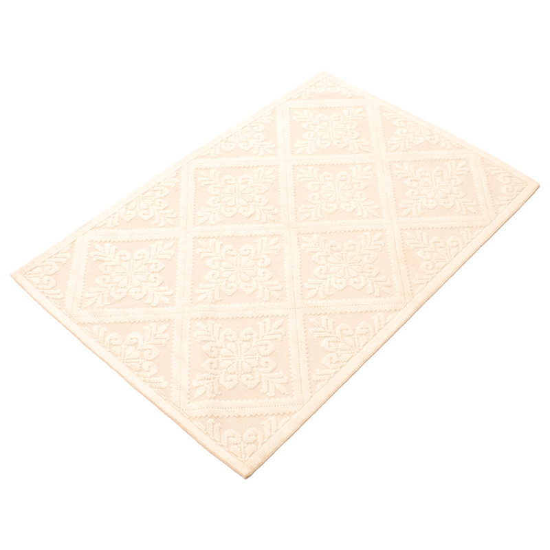 Tapis géométrique ivoire en coton tressé à la main