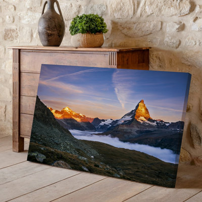 Canvas A Breathtaking Mountain Landscape At Sunset Featuring A Towering Snow Wall Art Capped Peak Illuminated By Warm Orange And Pink Canvas Wall Art