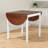 Solid pine drop-leaf table in warm brown, folds for small-space dining, rectangle