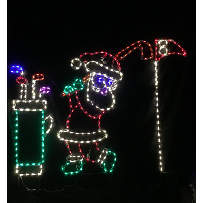 Père Noël jouant au golf avec sac et drapeau